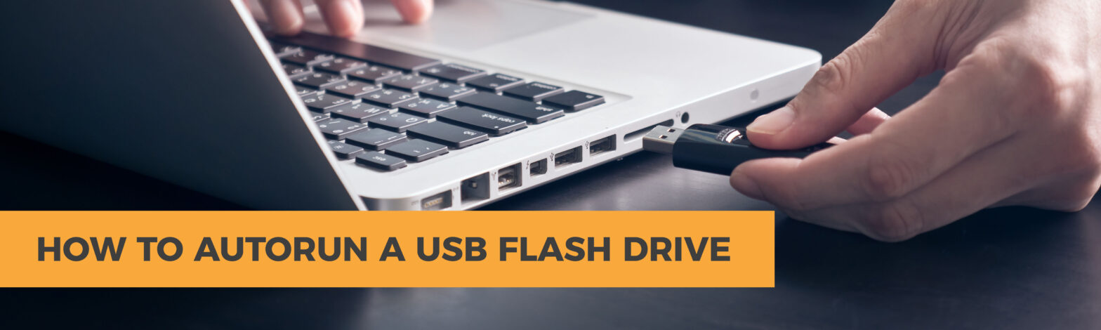 person plugin in a usb drive on a laptop